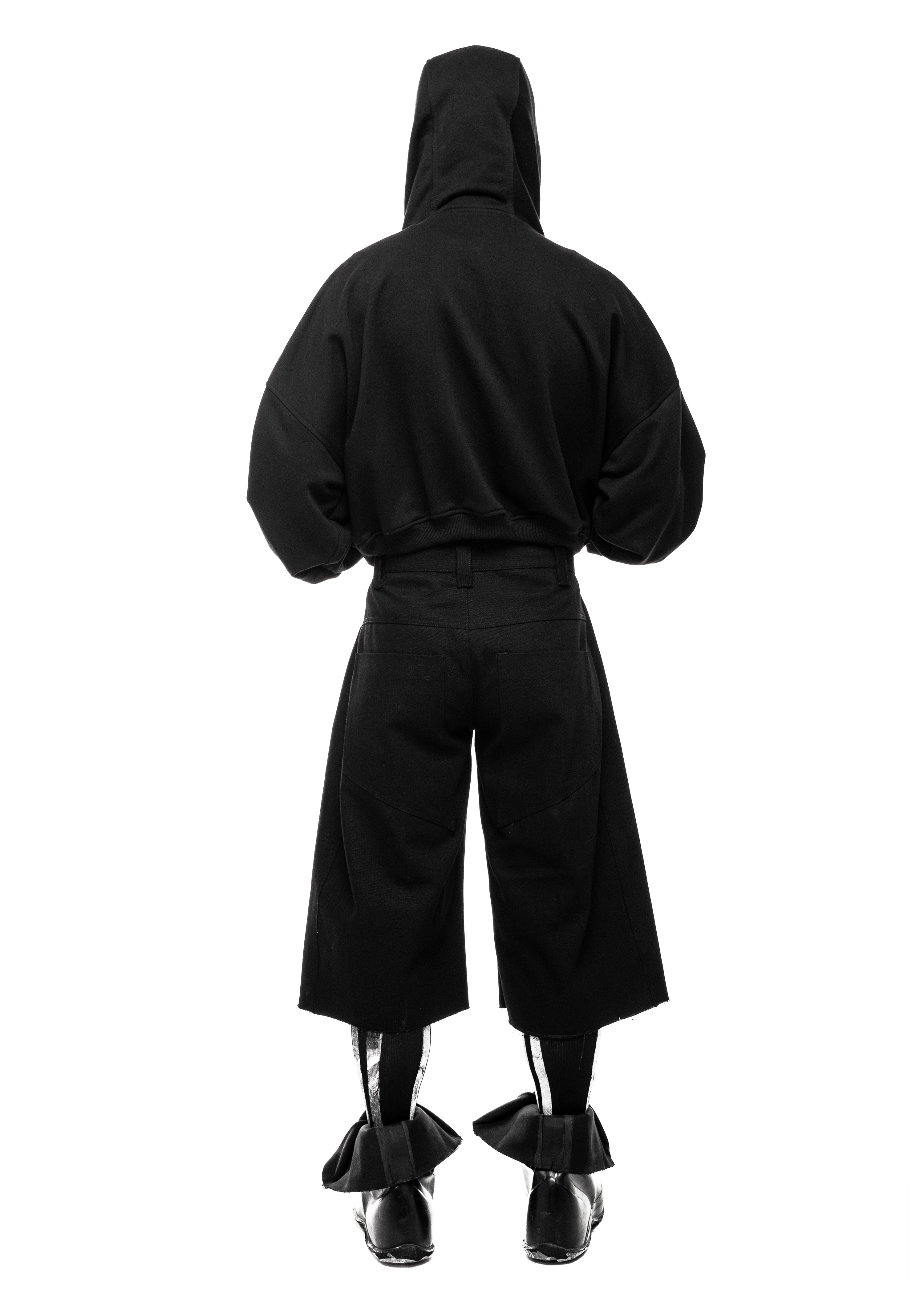 Back view of outfit with visible shorts silhouette and leg opening.