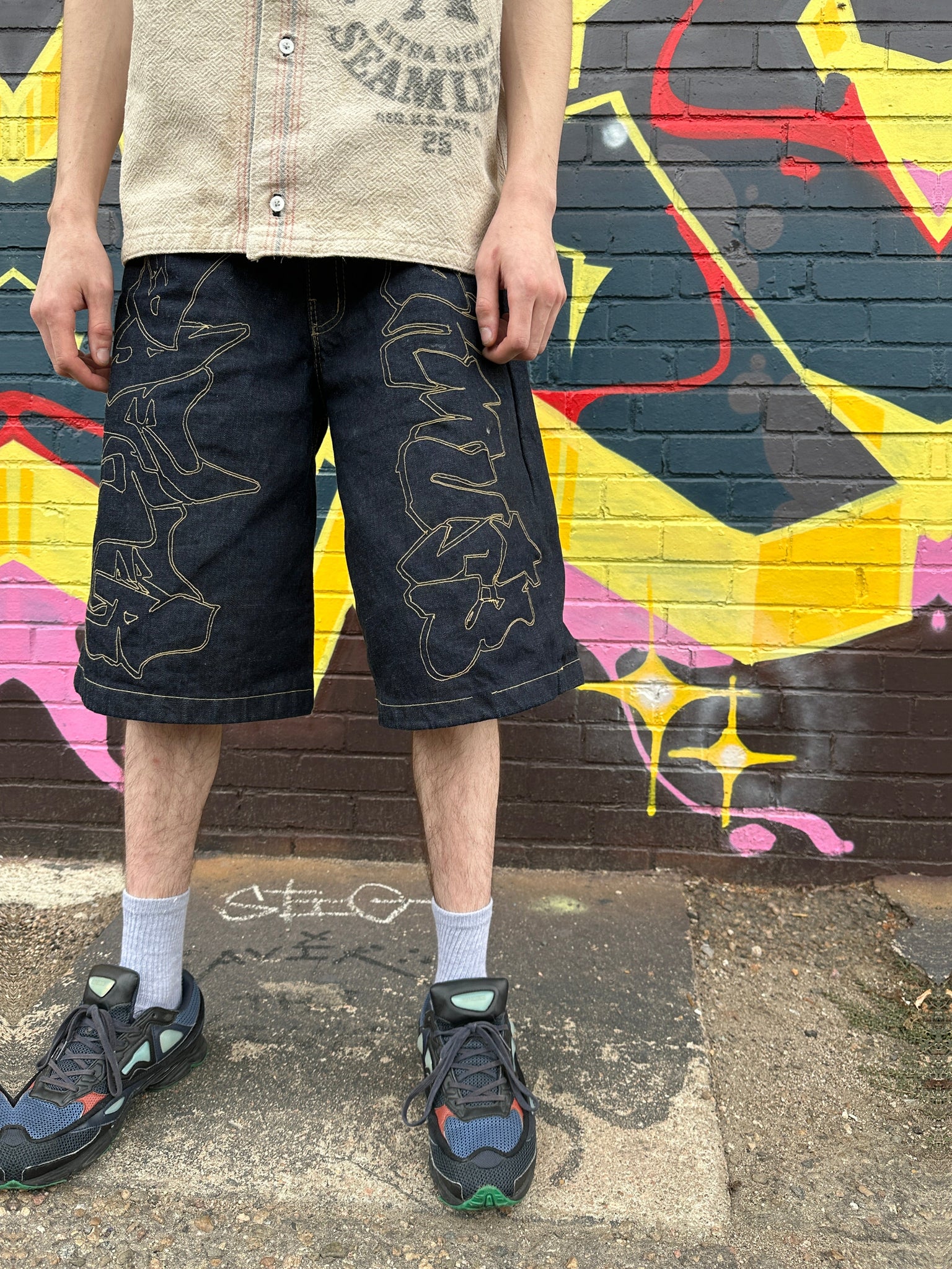 Cut and Sew Graffiti Jean Shorts