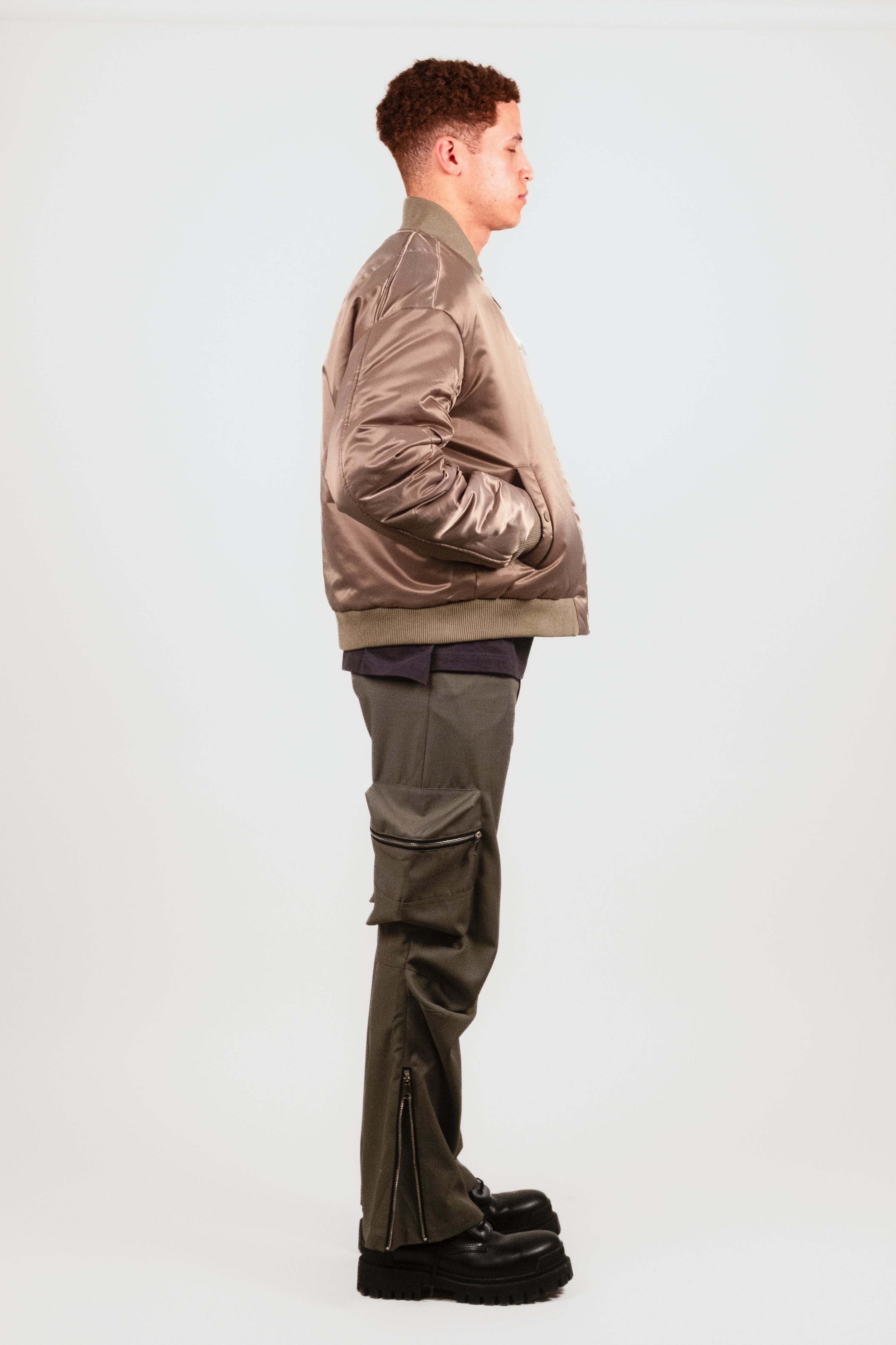 Alternate quarter angle of Nate in the Ruched Bomber — premium military-inspired outerwear with a cocoon fit and subtle fashion detailing.