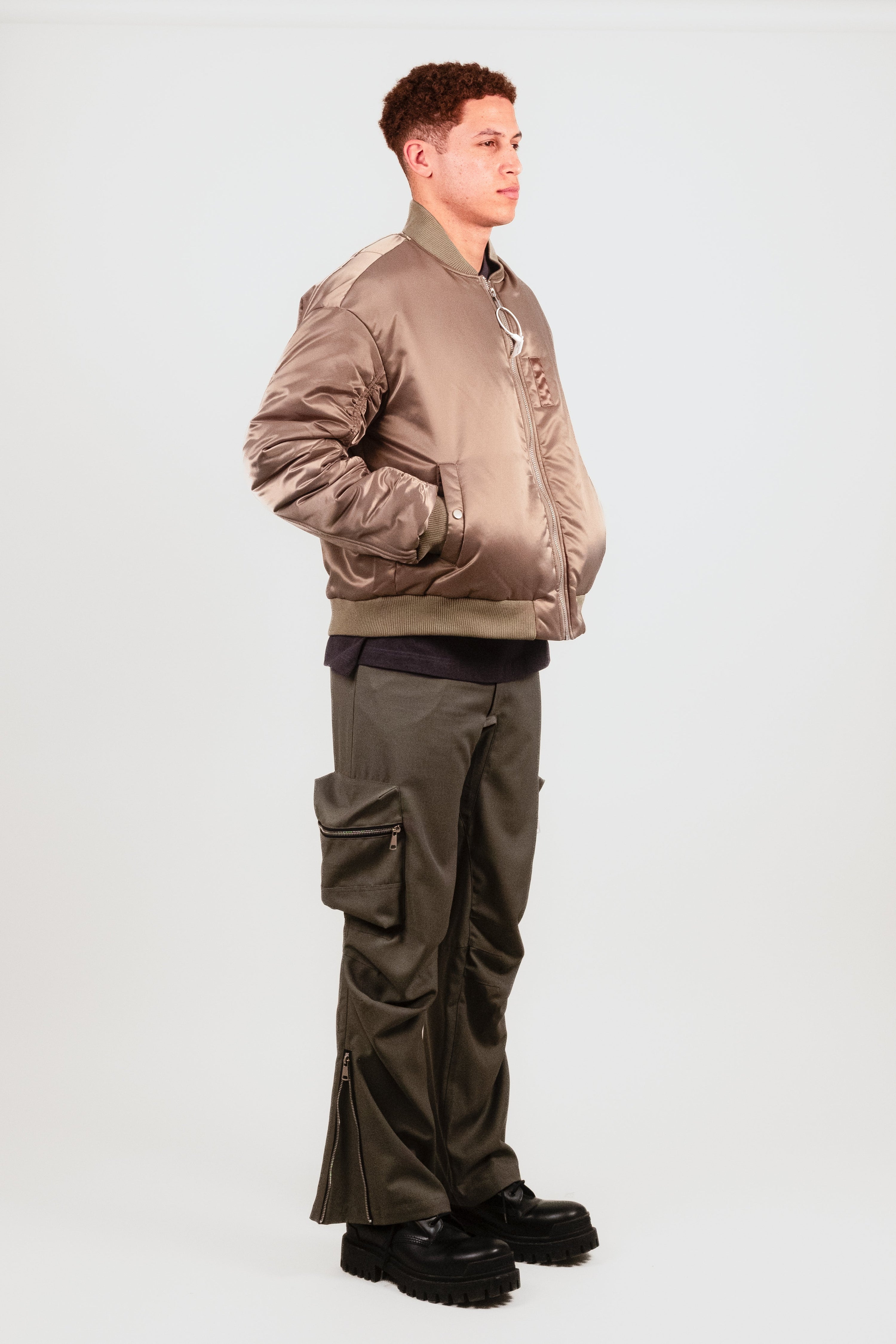 Alternate quarter angle of Nate in the Ruched Bomber — premium military-inspired outerwear with a cocoon fit and subtle fashion detailing.