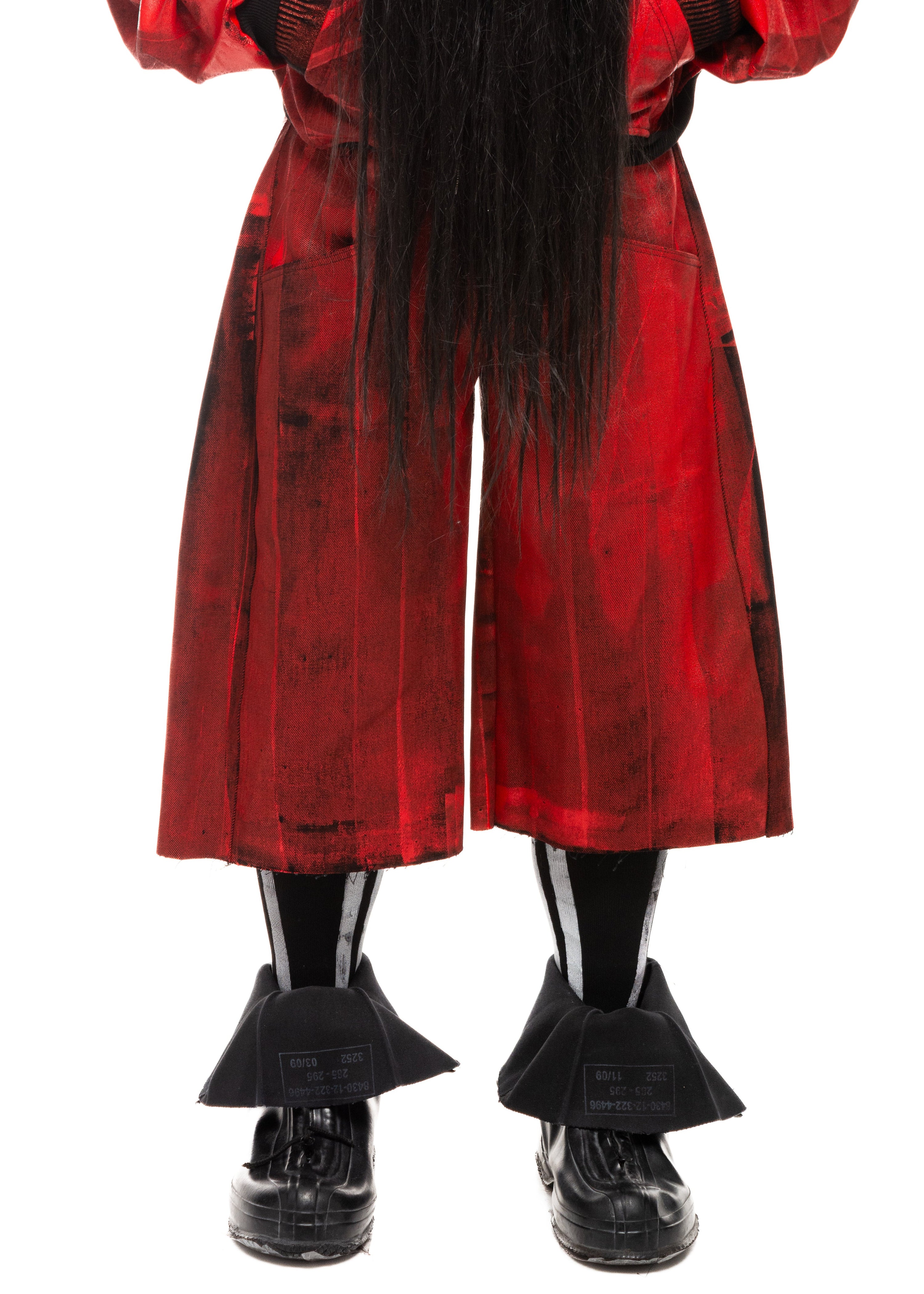 Close-up of red waxed denim texture and front stitching